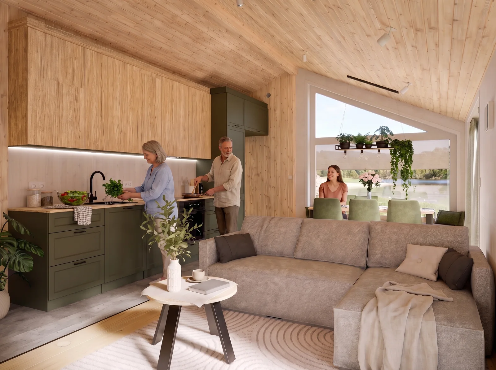 Menschen kochen und sitzen am Esstisch in der offenen Evergreen XL Wohnküche mit grauem Sofa